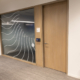 Wood veneer door beside a frosted glass office front at 19 Duncan St, 7th floor