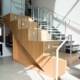 Wood-clad staircase with glass railing at St. Clair Silverthorn Library