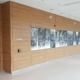 Wood-panelled synagogue lobby with backlit Star of David art display at Habonim