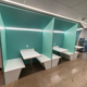 Row of mint green booths with white tables and benches in Spigel Hall (DV1102) at UTM