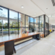 Long wood window counter on dark supports in the YorkU First Student Centre food court